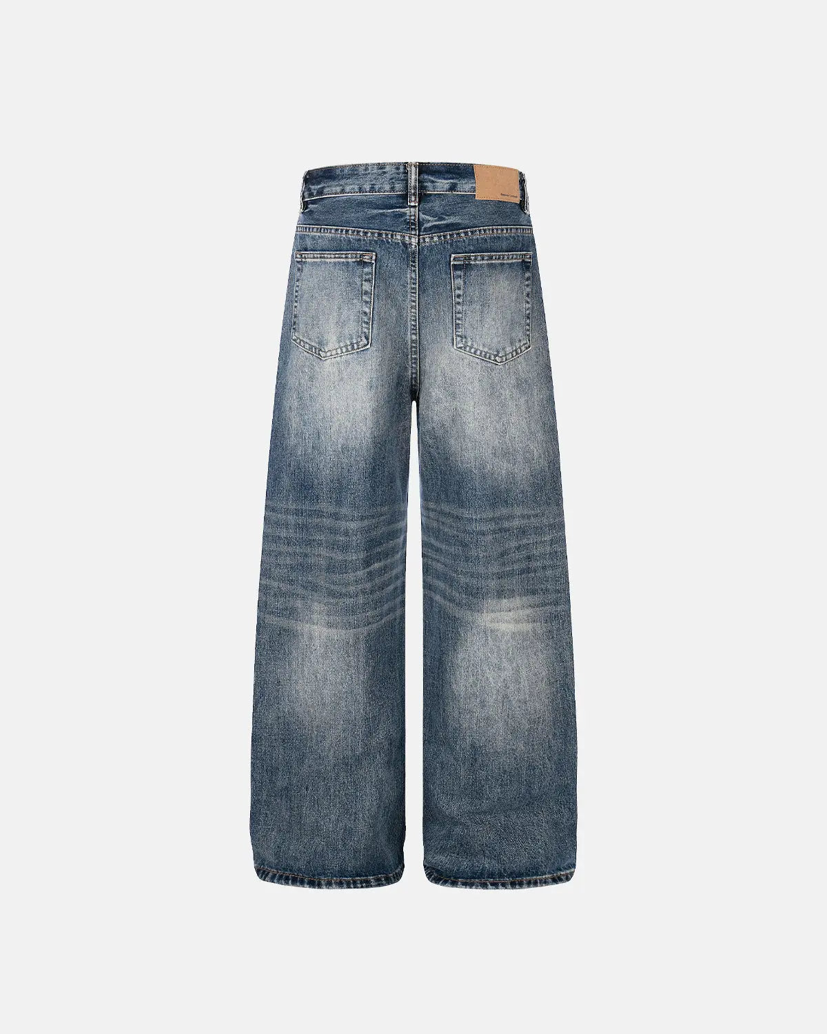 Distressed baggy jeans by INFLATION with whisker wash detailing, relaxed fit, and casual streetwear style.