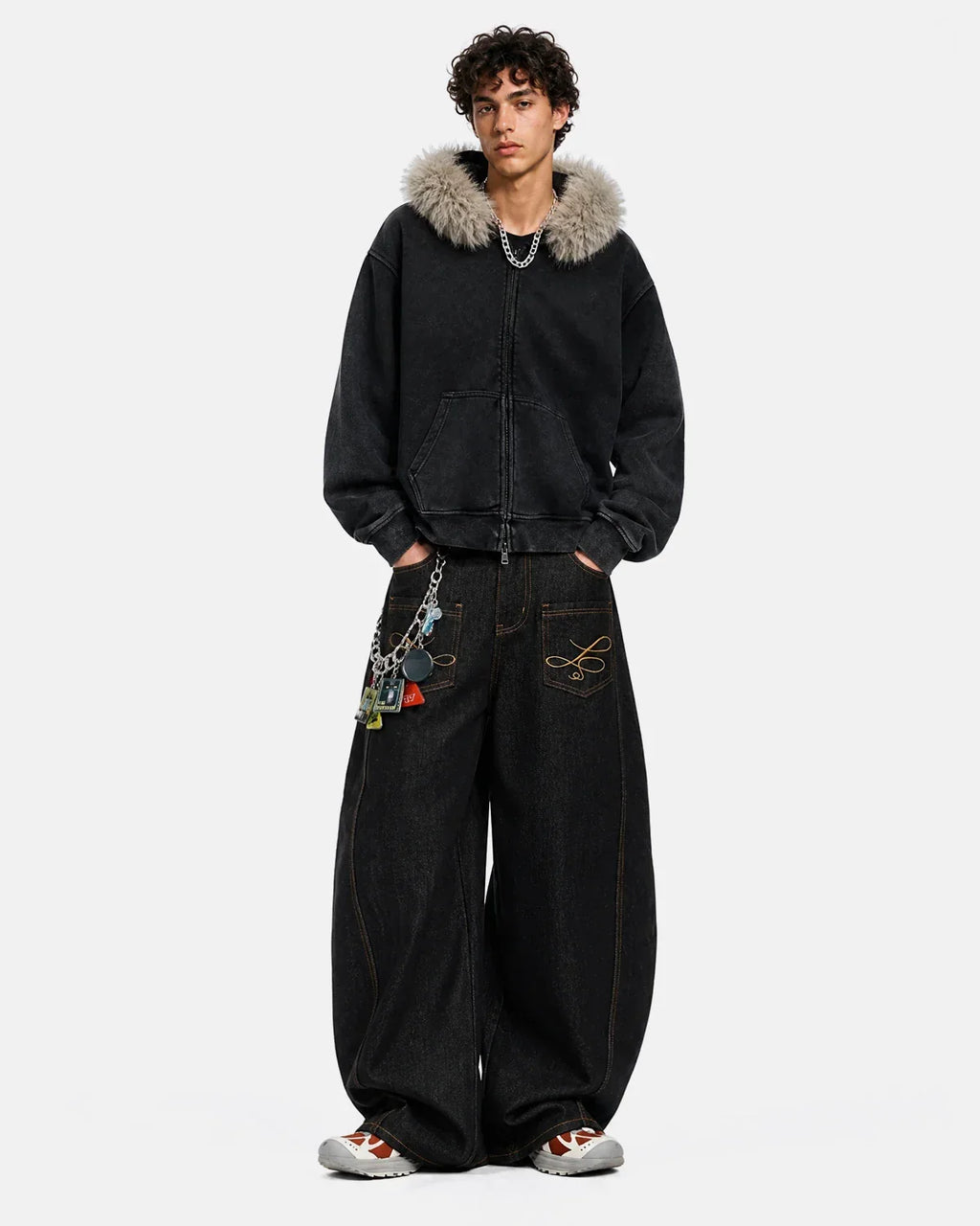 Raw barrel jeans with pocket embroidery from INFLATION streetwear, showcasing distressed denim and detailed stitching.