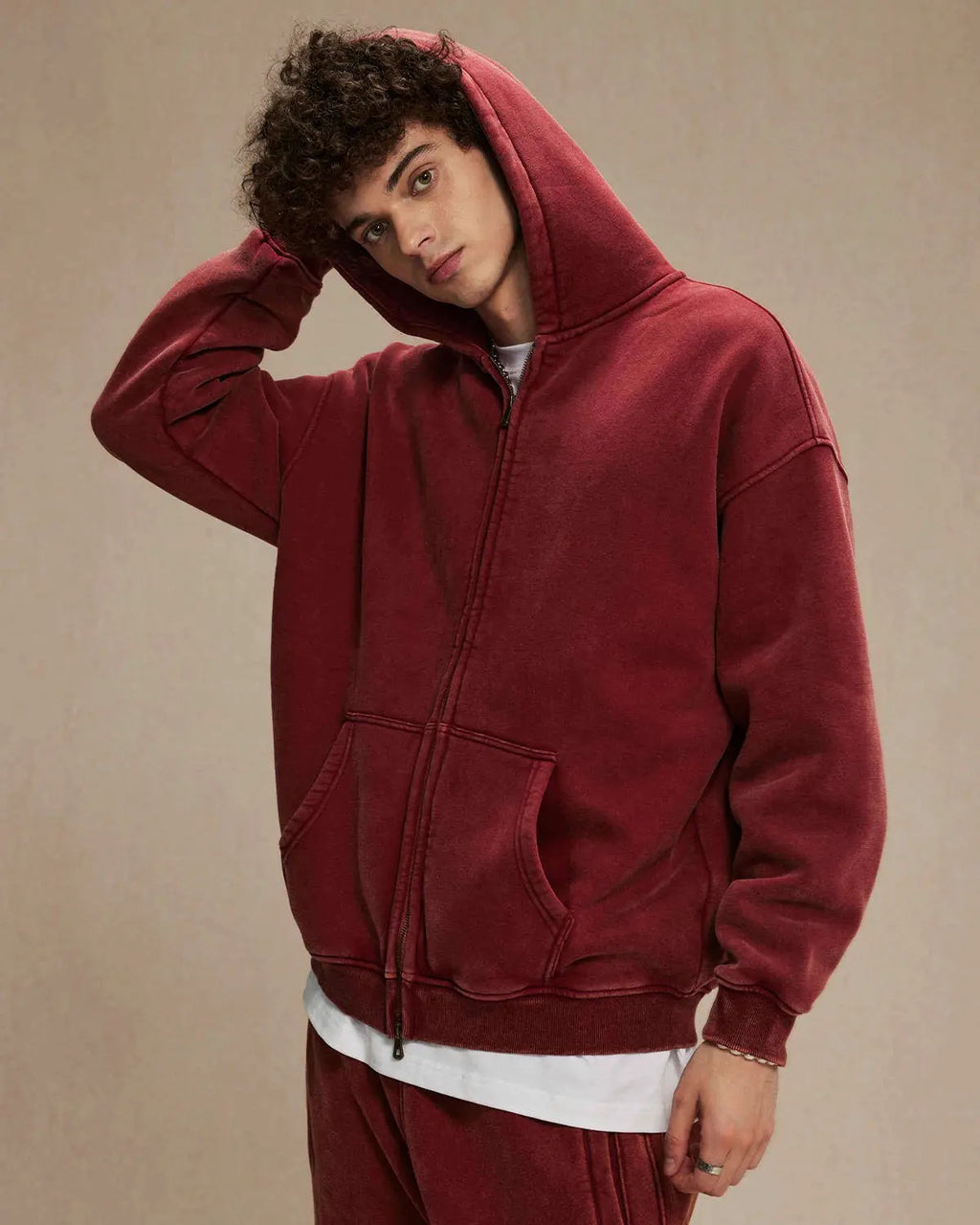 Acid washed distressed fleece zip-up hoodie by Flation, featuring a relaxed fit, hood, and distressed details on soft fabric.