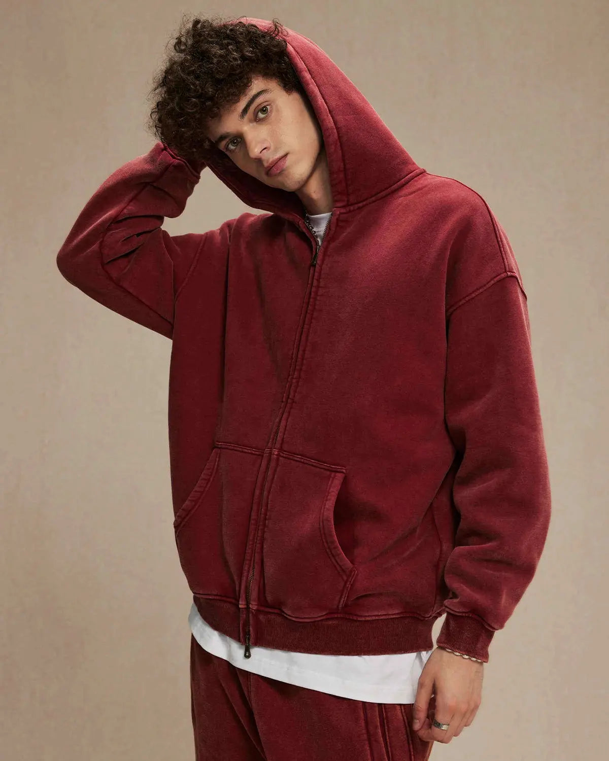 Acid washed distressed fleece zip-up hoodie by INFLATION, featuring a relaxed fit, distressed details, and a front zipper.