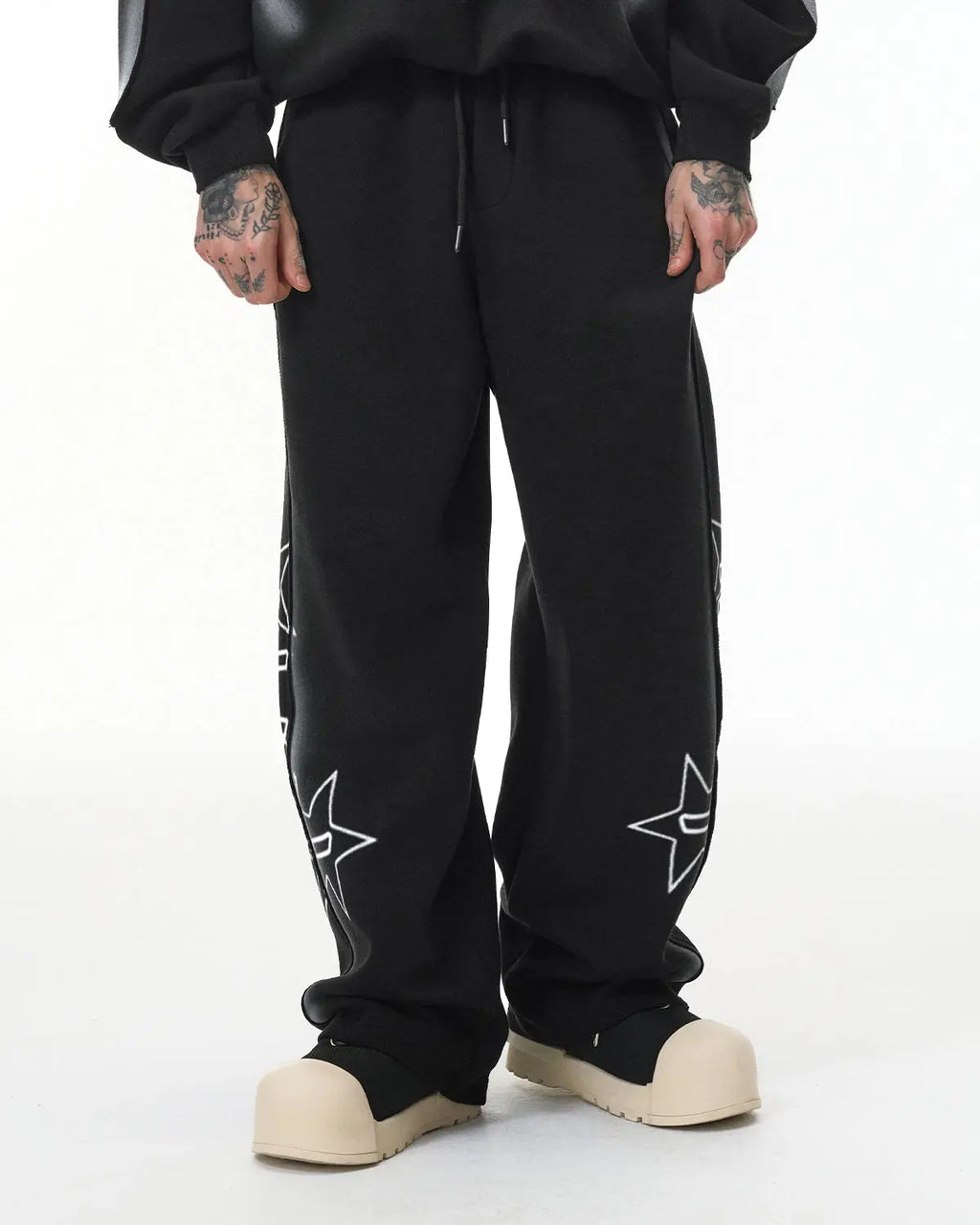 Flation streetwear graffiti sweatpant featuring colorful stitching spray paint design, casual fit, and street-inspired style.