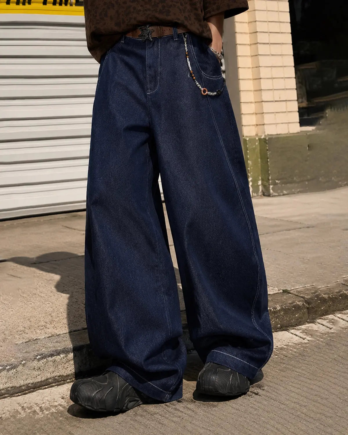 Raw washed barrel jeans by Flation Streetwear, showing relaxed fit denim pants with distressed details and sturdy belt loops.