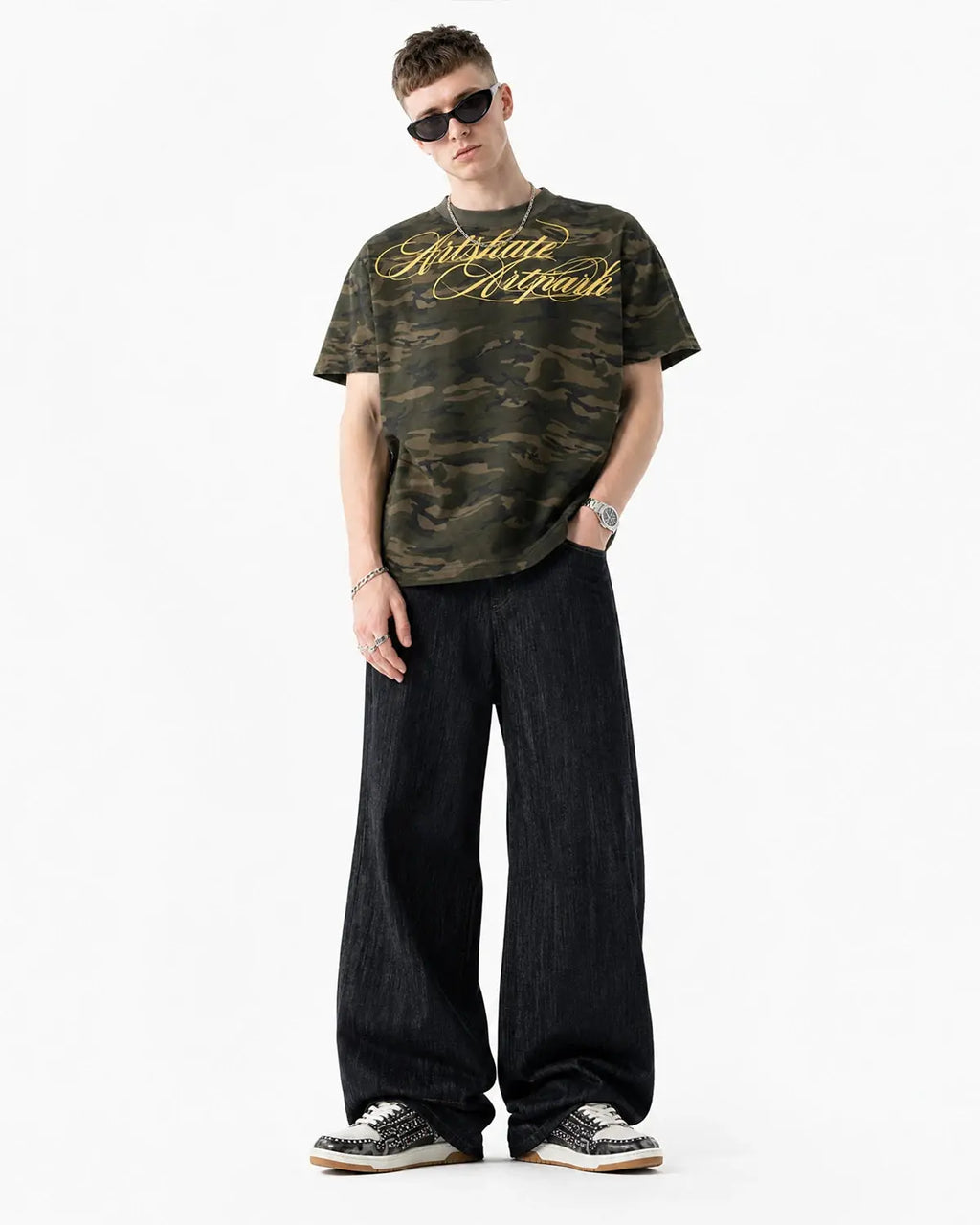 Embroidered raw baggy jeans from Inflation Streetwear with colorful embroidery details and relaxed fit.