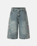 Floral embroidered long baggy jorts by INFLATION, stylish streetwear pants with colorful floral embroidery and relaxed fit.