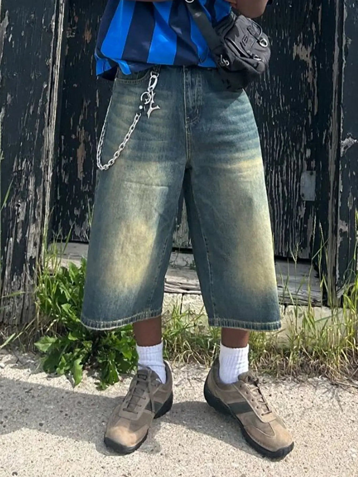 Baggy jumbo jorts by Flation Streetwear featuring distressed denim and oversized fit, displayed on a hanger.