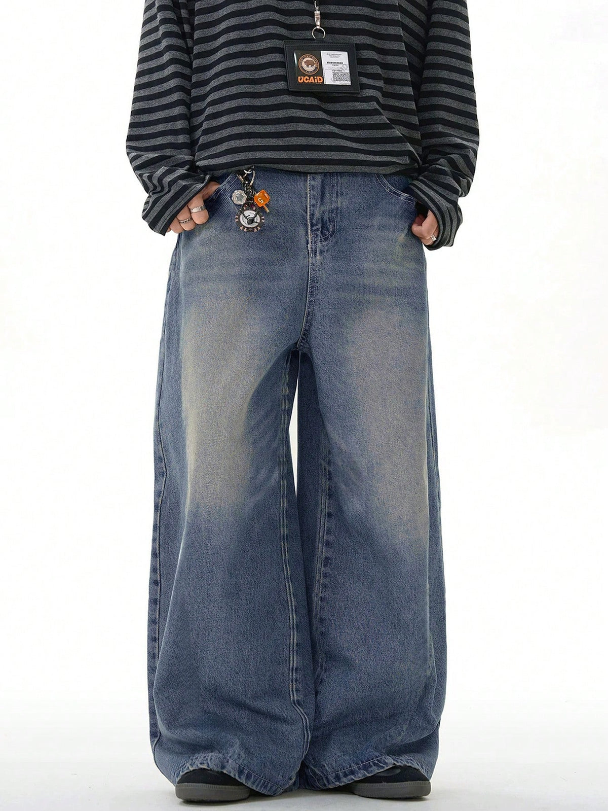 Inflation vintage distressed denim jeans with wide leg, loose fit, and distressed details, shown in a casual style.