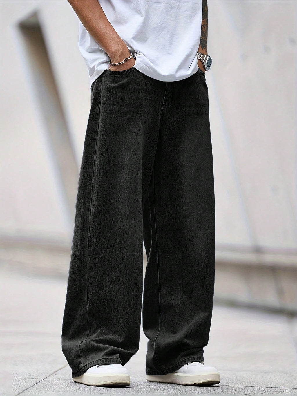 Black Flation street style loose denim jeans with relaxed fit, showcasing casual streetwear fashion.