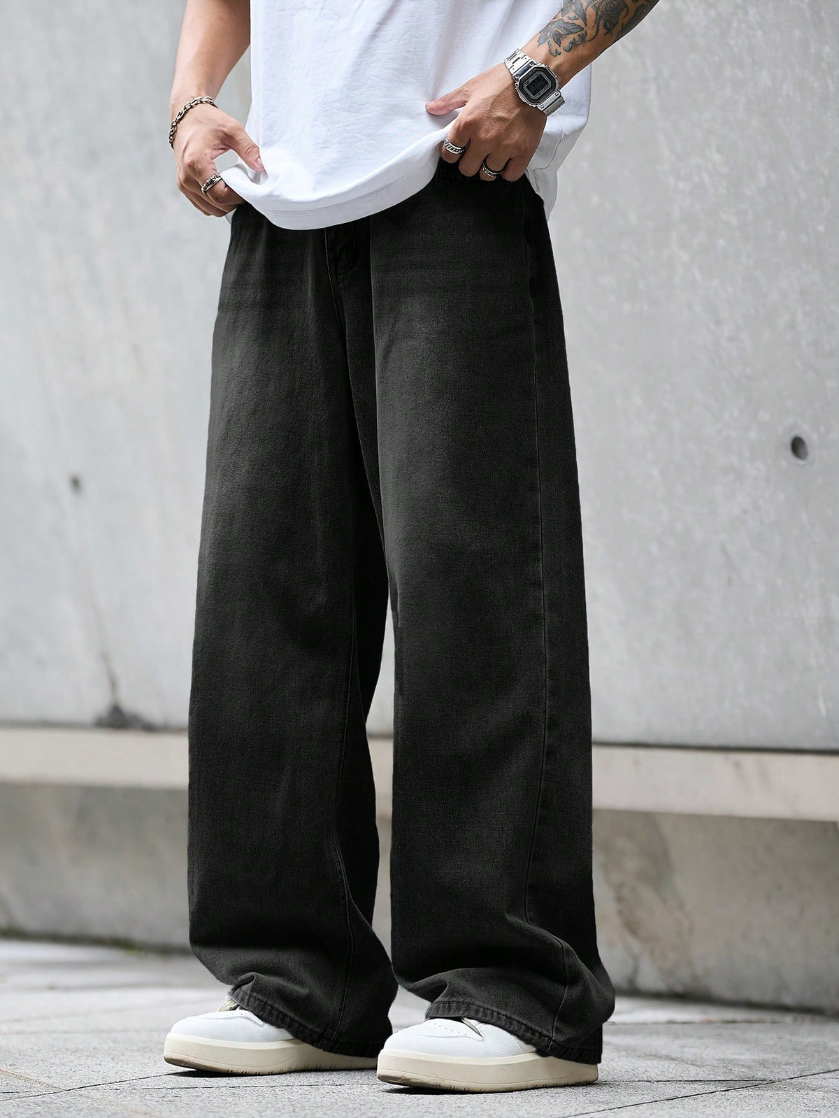 Black Flation street style loose denim jeans with a relaxed fit, featuring classic five-pocket design and distressed details.