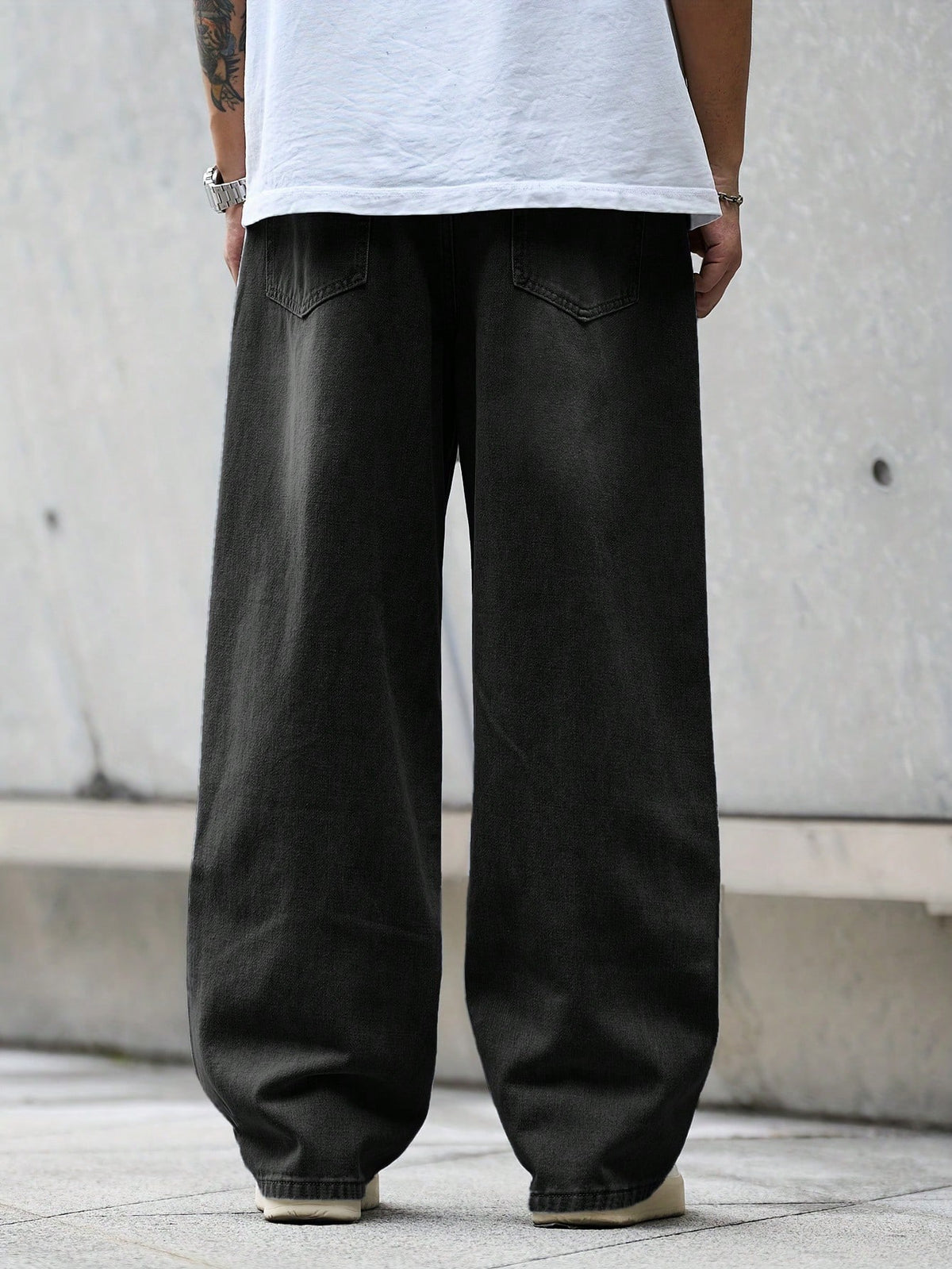 Black Flation street style loose denim jeans with a relaxed fit, featuring classic denim texture and casual design.
