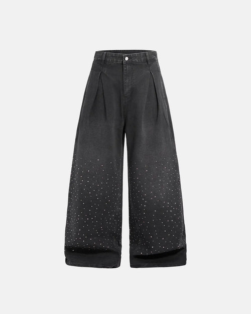 Acid washed rhinestone baggy jeans by Flation Streetwear, featuring distressed fabric and rhinestone embellishments.