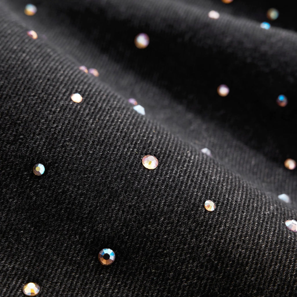 Acid washed rhinestone baggy jeans by Flation Streetwear featuring a relaxed fit and sparkling rhinestone details.