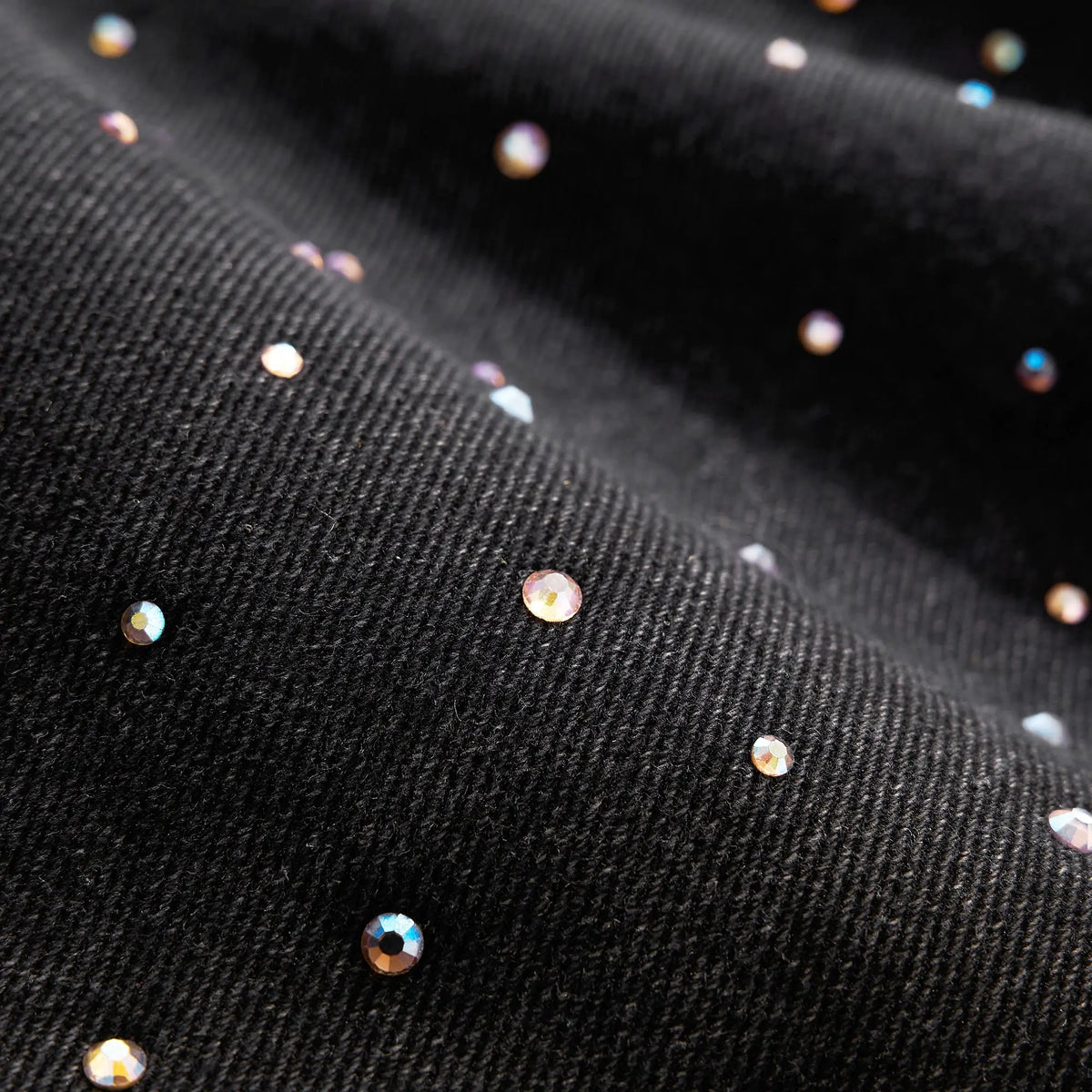 Acid washed rhinestone baggy jeans by Flation Streetwear featuring a relaxed fit and sparkling rhinestone details.