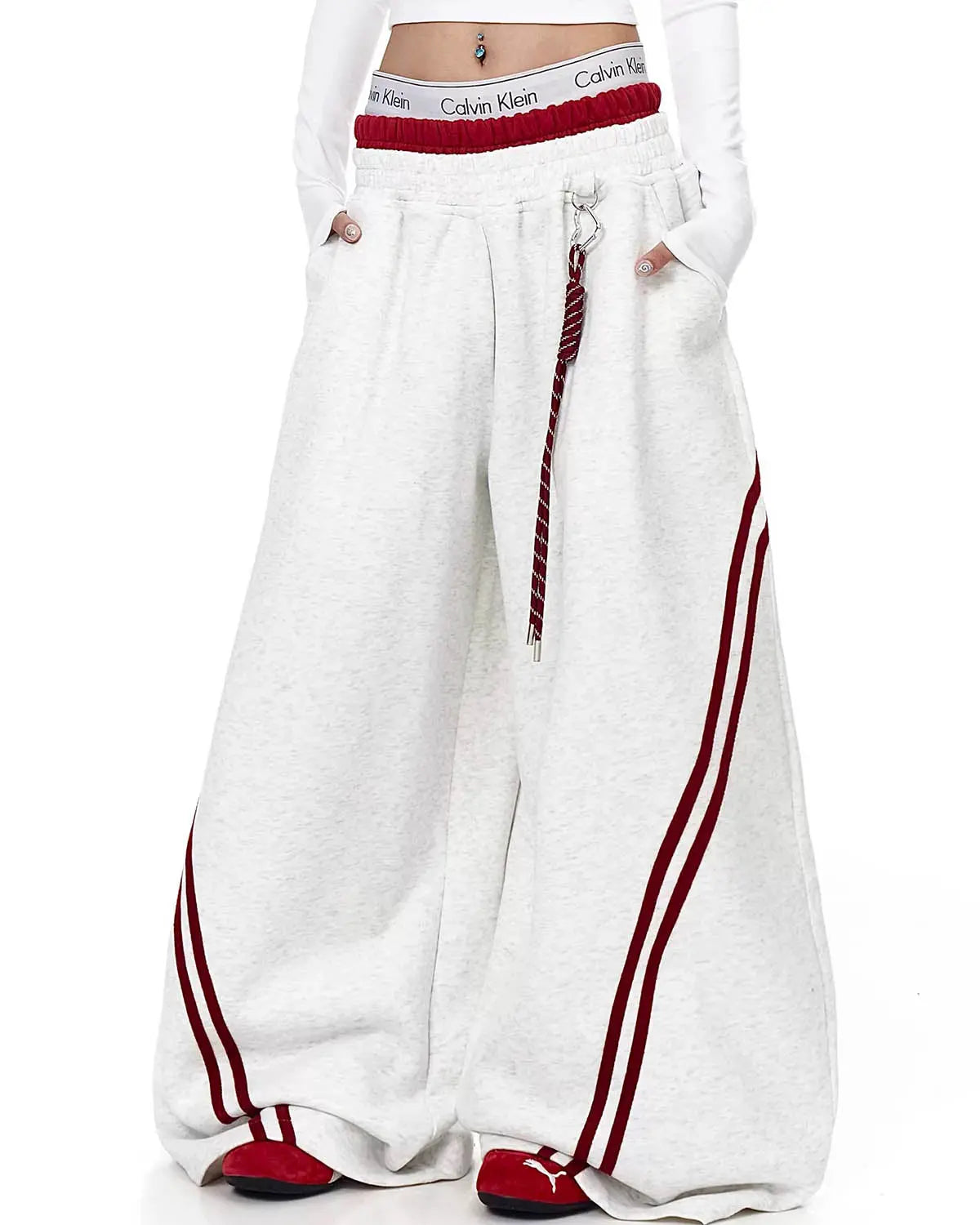 Grey striped baggy sweatpants by INFLATION Streetwear, featuring a relaxed fit and comfortable fabric.