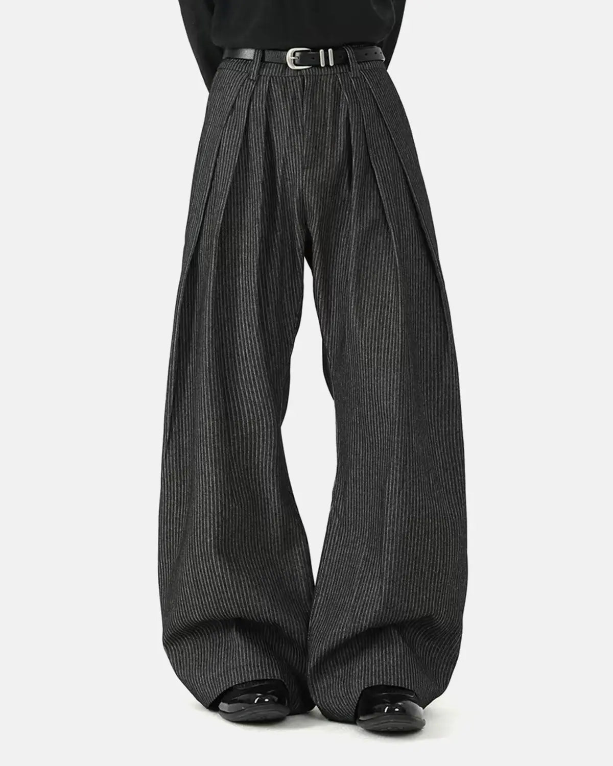 Vintage pinstripe pleated barrel jeans by INFLATION featuring a relaxed fit and classic style, shown on a model.