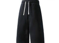 Flation Trending Long Jogger Shorts in black with elastic waistband and side pockets, casual athletic style for comfortable wear.