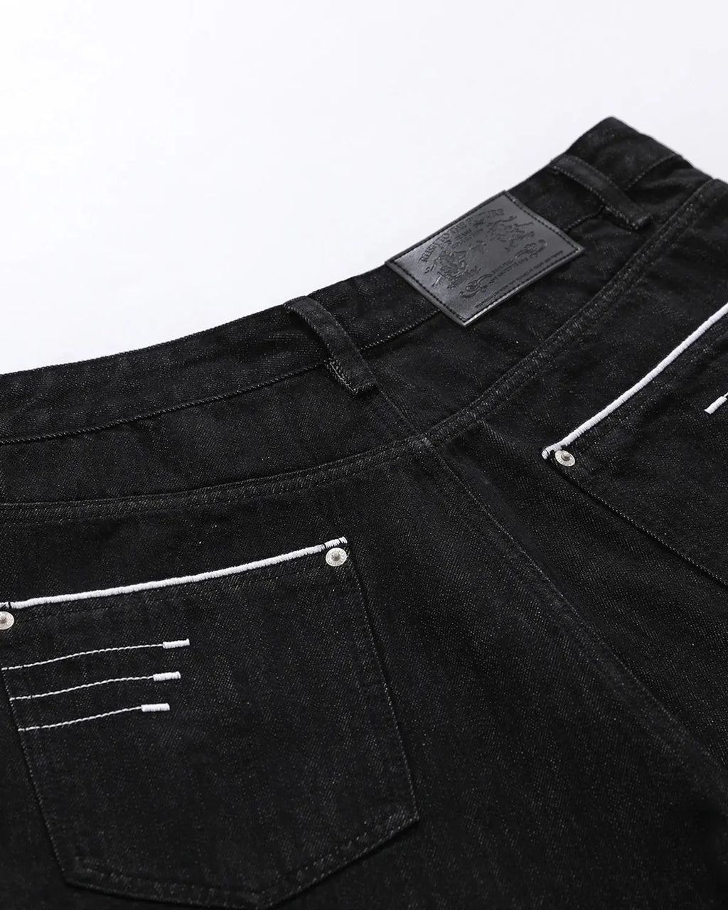 Inflation Streetwear longline wide-leg jorts pants with distressed denim and frayed hems, casual streetwear style.