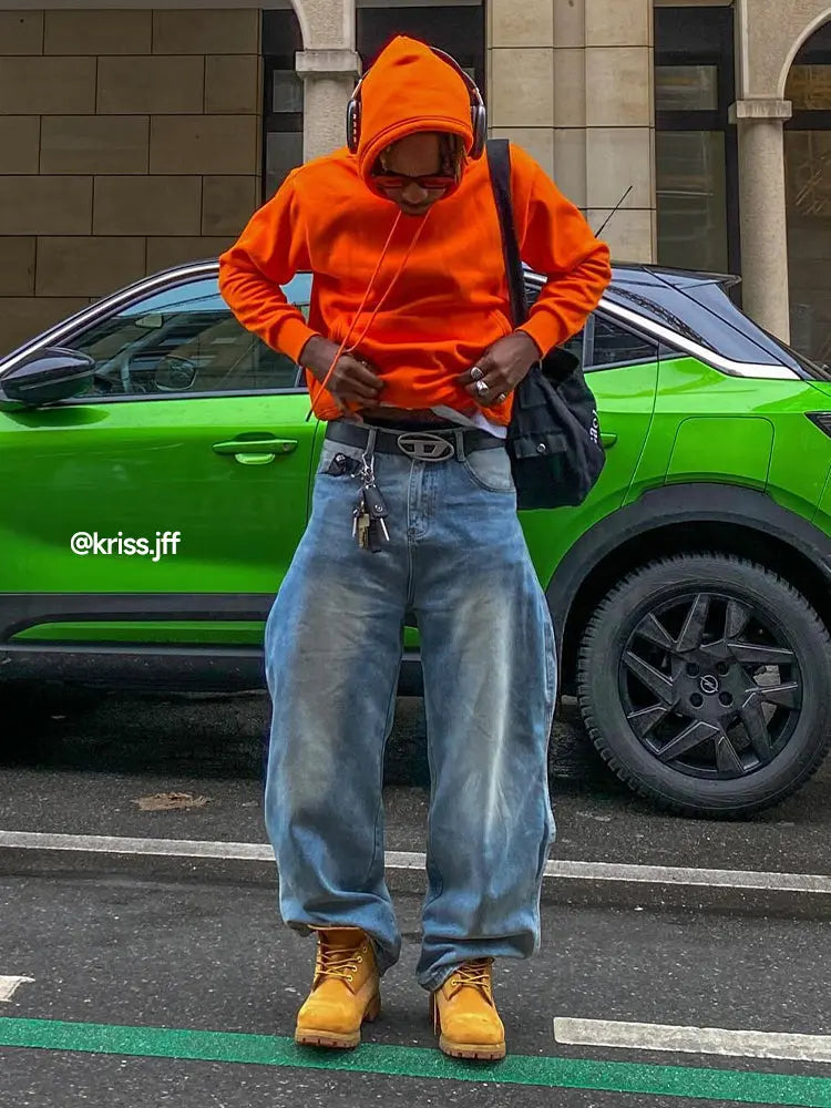 InflationUS washed baggy denim pants with relaxed fit and distressed details, styled with casual streetwear look.
