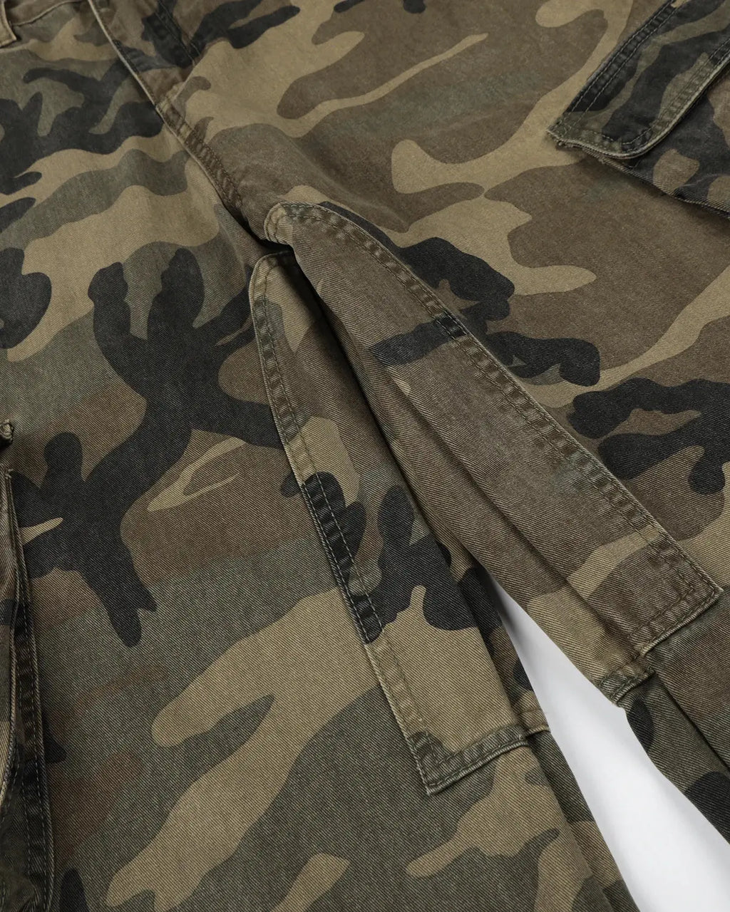 Camo cargo barrel pants by INFLATION featuring a relaxed fit, multiple pockets, and a streetwear-inspired design.