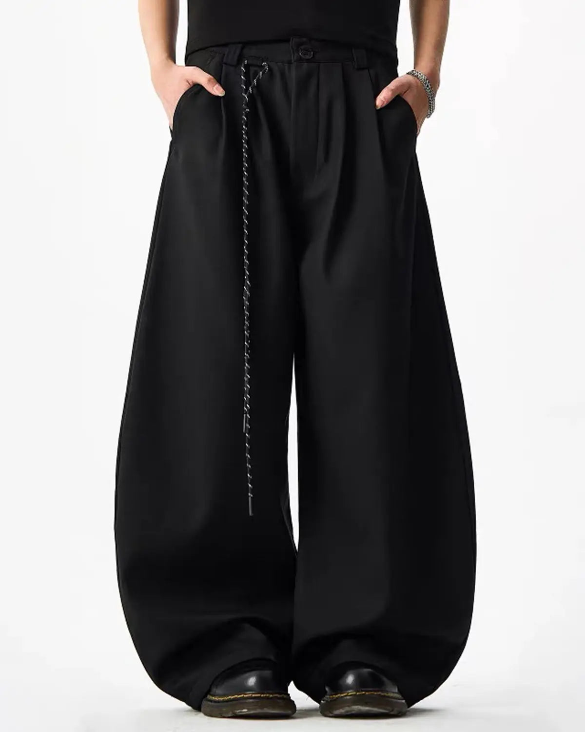 Wide-leg tailored pants with a rope belt from INFLATION's streetwear collection, shown in a stylish fit and neutral fabric.
