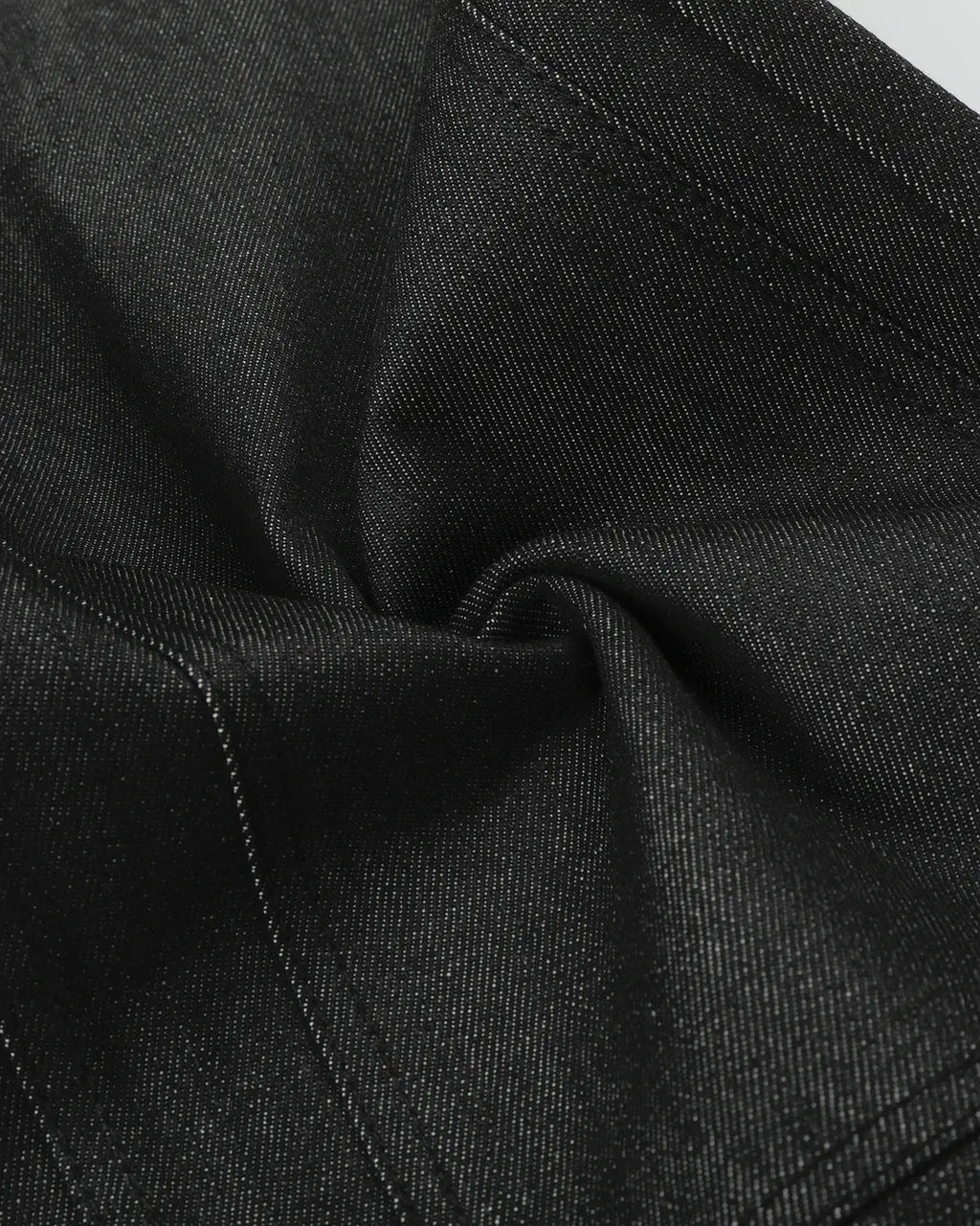 Deconstructed utility baggy jeans by INFLATION featuring a relaxed fit, multiple pockets, and distressed denim details.