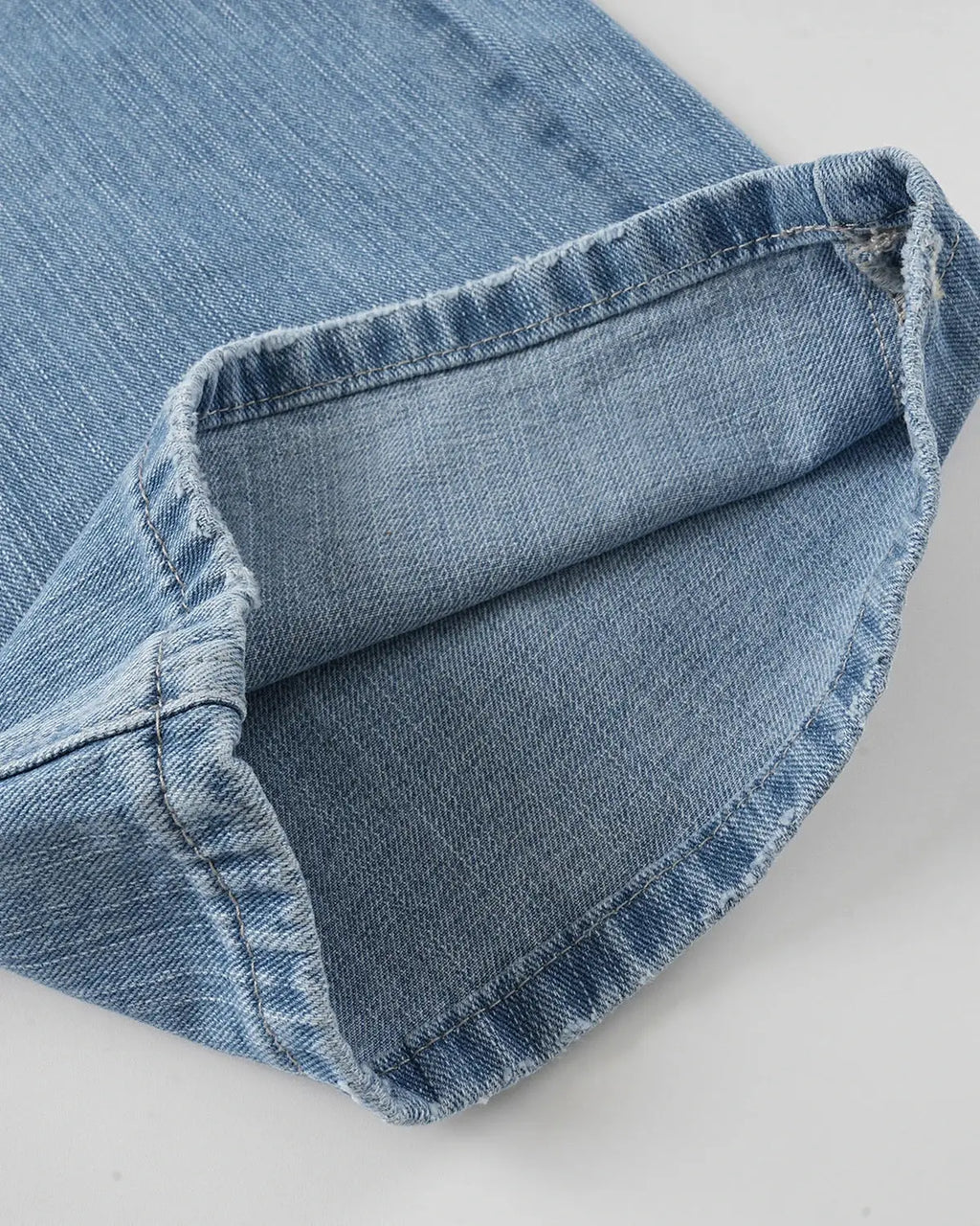 Inflation Cross Stud Bamboo Weave Baggy Jeans with distressed detailing and relaxed fit, showcasing denim fabric and unique design.