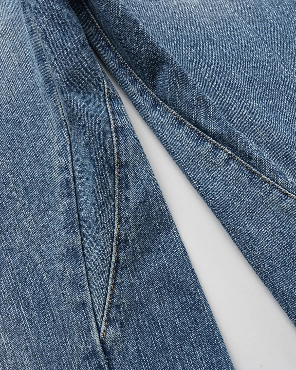 Bamboo weave cinch back baggy jeans by INFLATION Streetwear with relaxed fit and wide leg style, showing front view and adjustable waist.