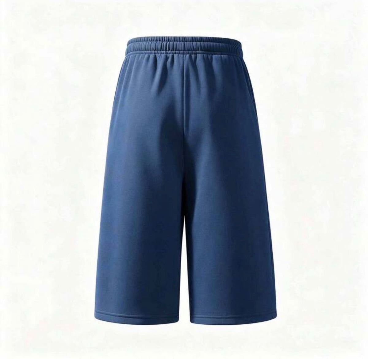 Flation trending long jogger shorts in neutral fabric with elastic waistband and relaxed fit, shown on a model.