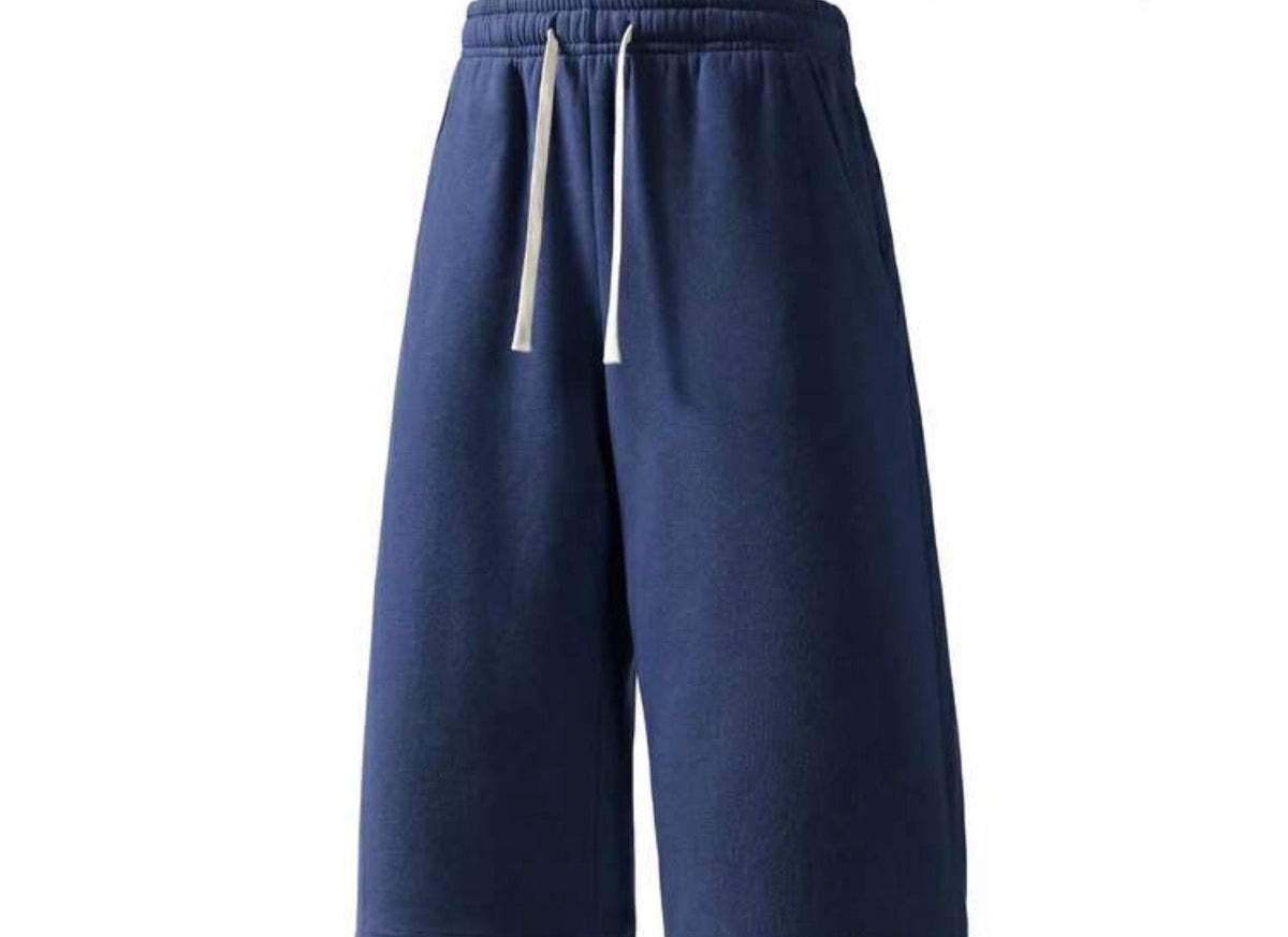 Flation Trending Long Jogger Shorts in neutral color, featuring relaxed fit and elastic waistband, designed for casual comfort.