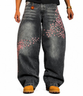 Flation Sakura black and grey wash baggy denim jeans with relaxed fit and distressed details, shown on a model.