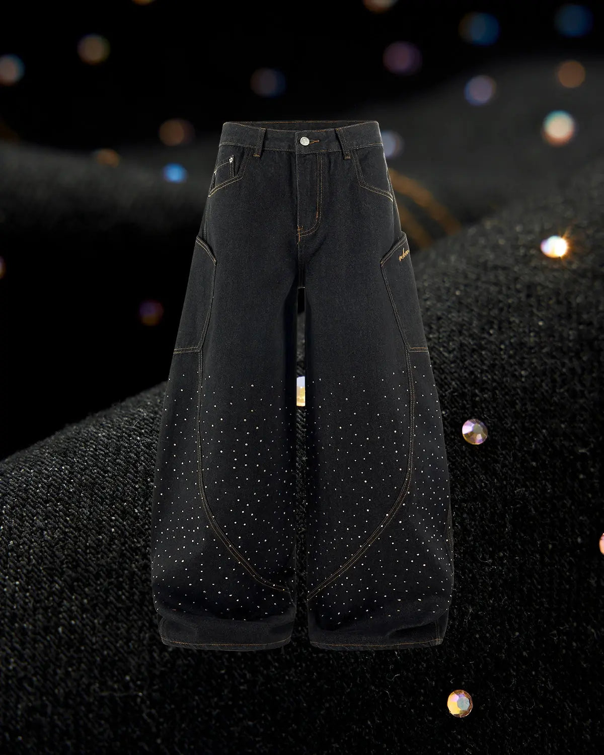 Colorful rhinestone raw barrel jeans by Flation featuring vibrant embroidery and distressed denim for streetwear style.