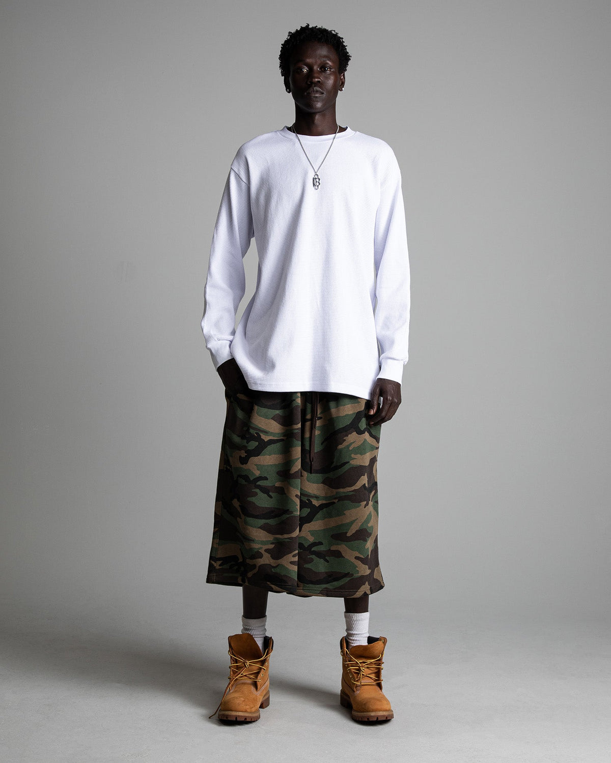 Shaka Wear heavyweight long-sleeve thermal shirt in black, showing the thermal fabric and fit on a mannequin.