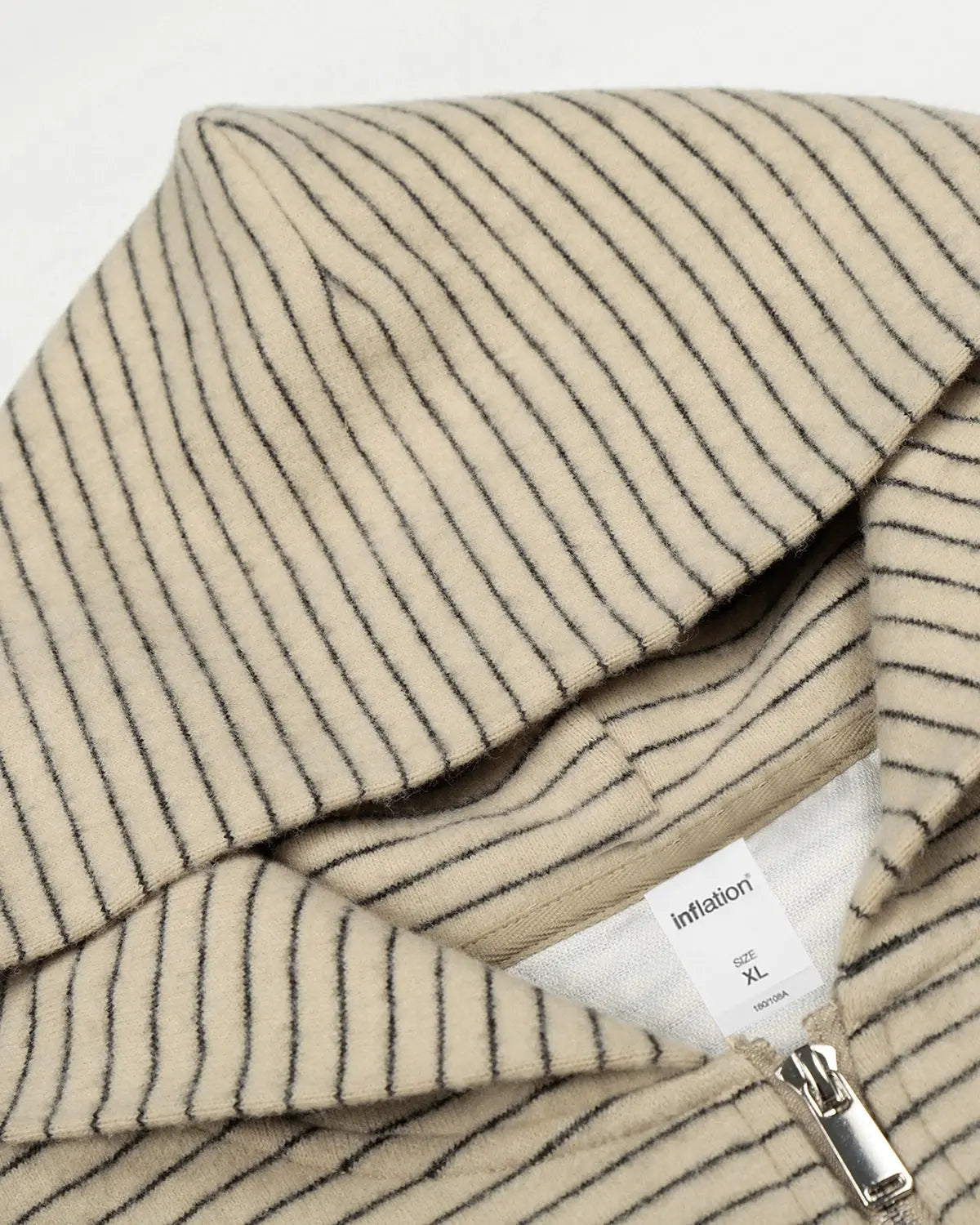 Retro striped zip-up hoodie by Flation Streetwear featuring bold color stripes and a front zipper on soft fabric.