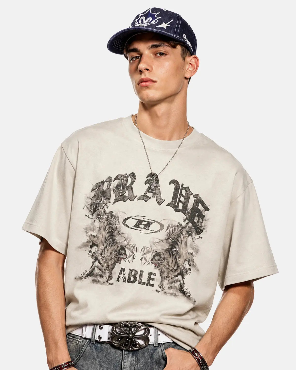 Apricot-colored vintage oversized graphic T-shirt by Flation Streetwear, featuring a washed, distressed design with bold print.