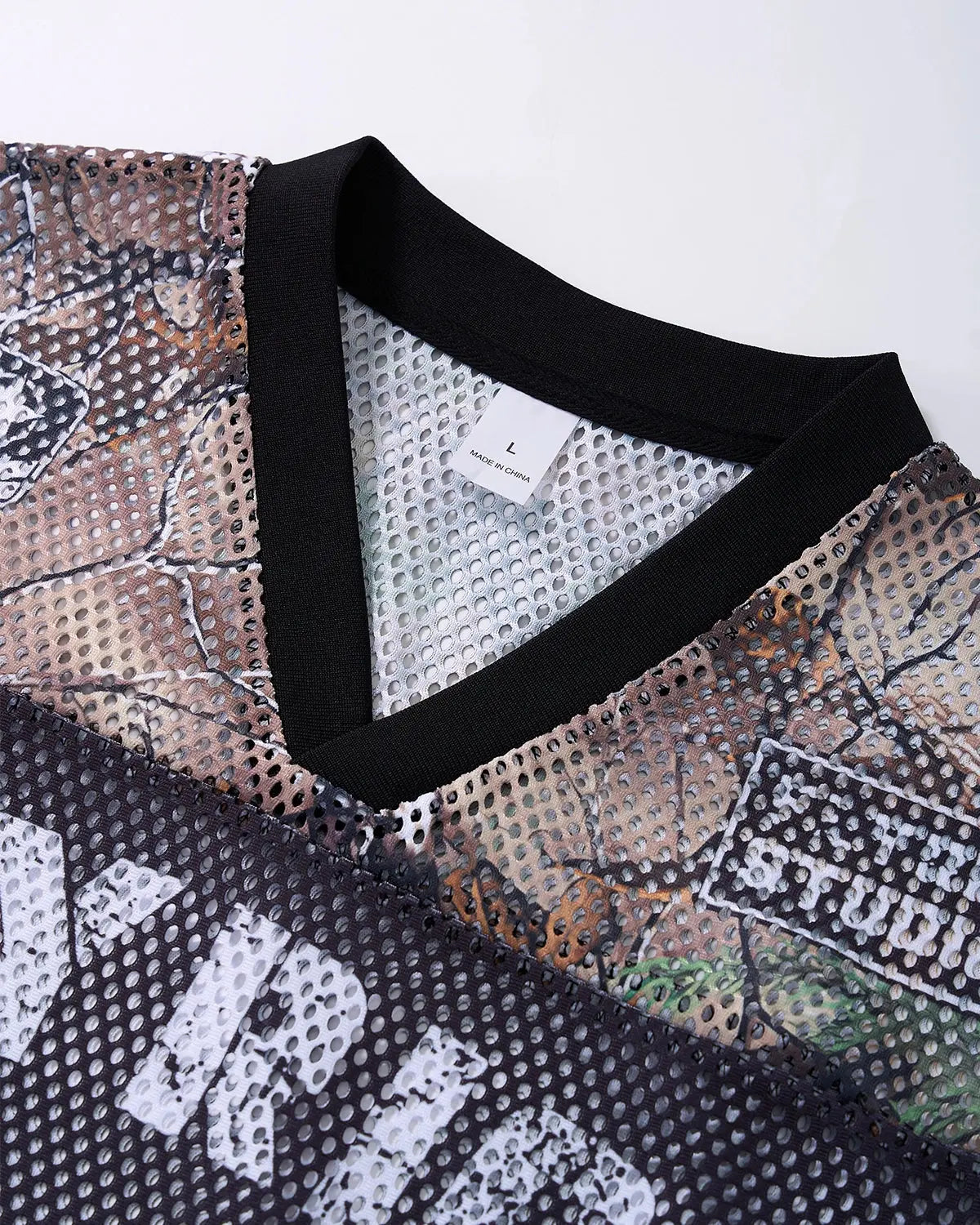 Camo mesh digital print jersey tee by Flation Streetwear featuring camouflage pattern and lightweight fabric.