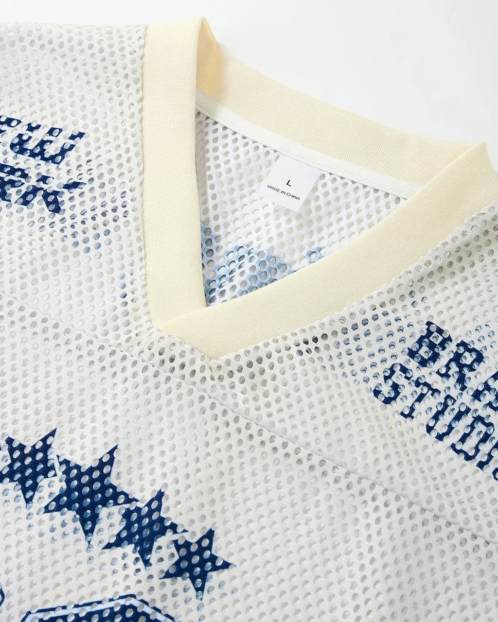 Flation Star Graphic Oversized Mesh Jersey featuring bold star print, streetwear style, and breathable mesh fabric.
