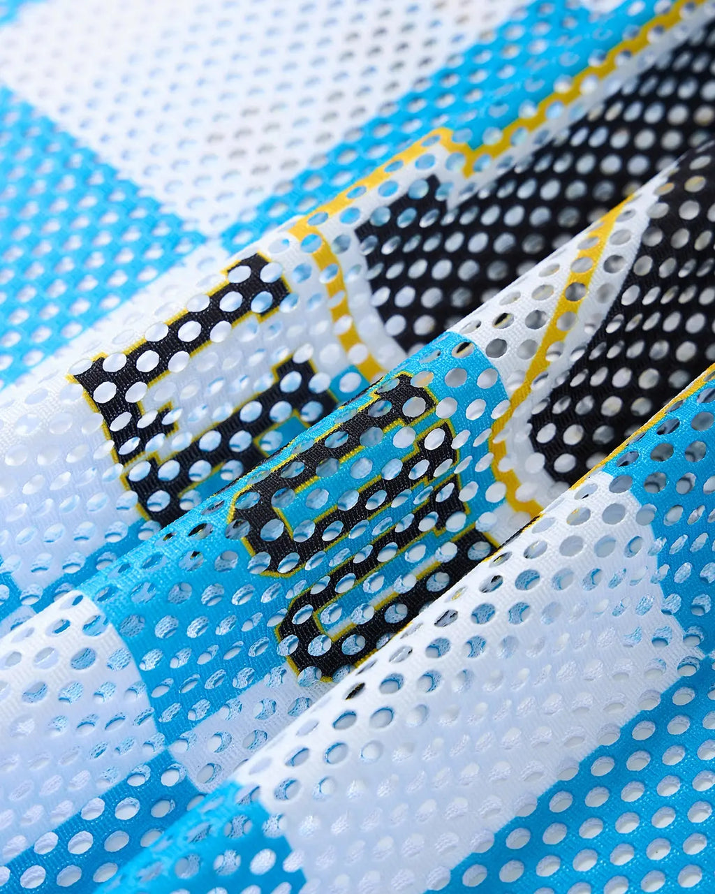 Varsity checkerboard mesh jersey by Flation Streetwear featuring black and white checkered pattern and sporty streetwear style.