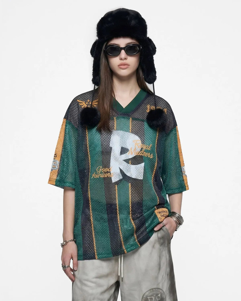 Vintage striped mesh jersey by Flation Streetwear featuring breathable fabric and bold stripe pattern, worn as casual street fashion.
