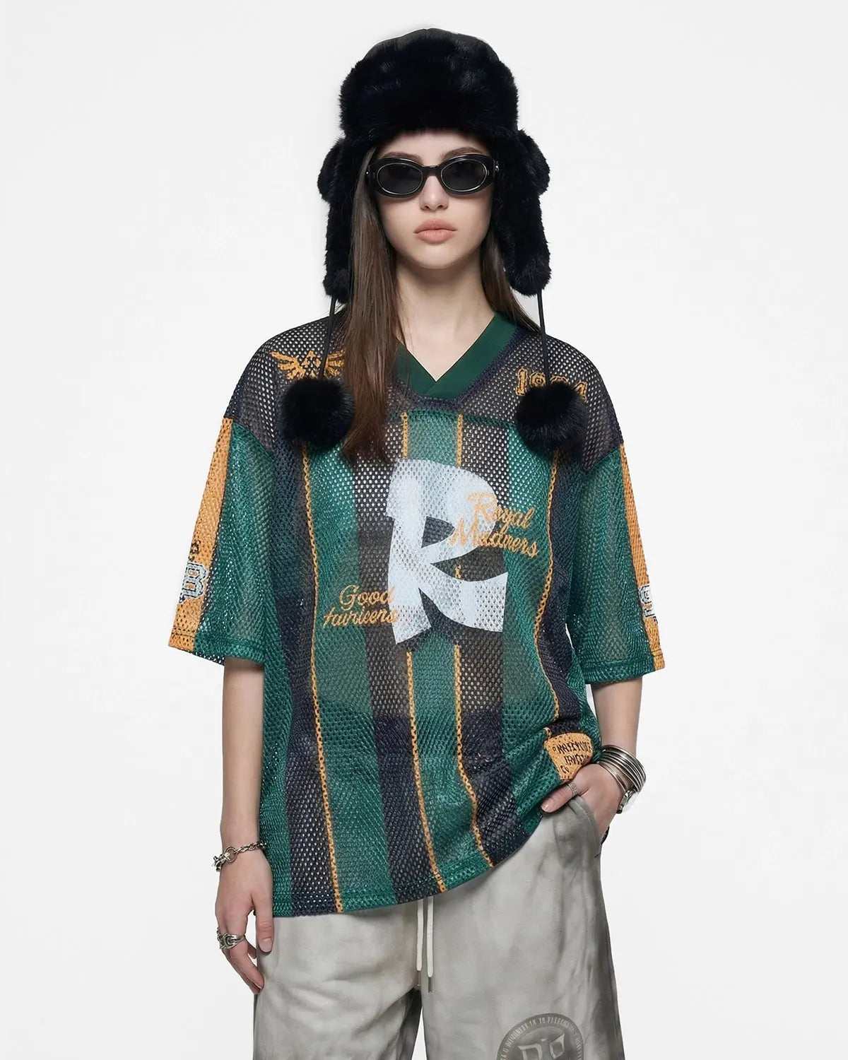 Vintage striped mesh jersey by Flation Streetwear featuring breathable fabric and bold stripe pattern, worn as casual street fashion.