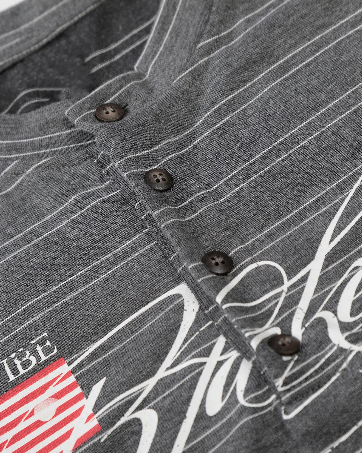 Layered Henley Stripe T-Shirt by Flation Streetwear featuring a casual fit with horizontal stripes and a layered neckline design.