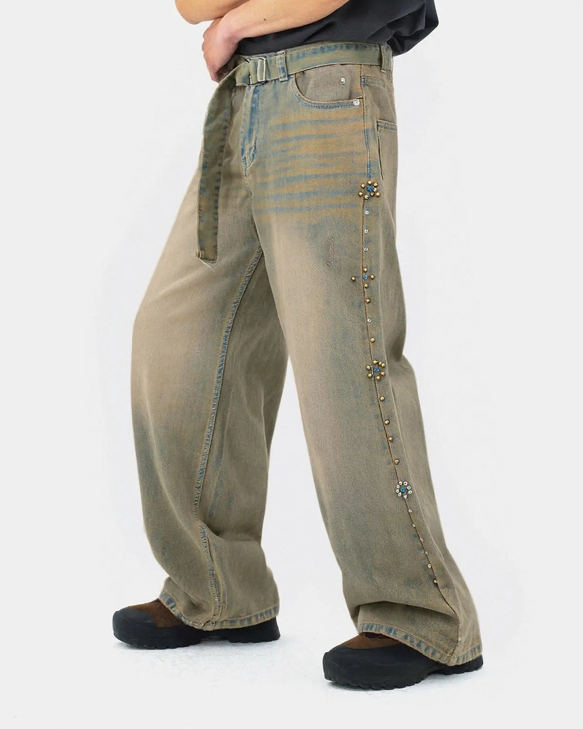 Beaded studded washed baggy jeans by Flation Streetwear featuring distressed denim and decorative bead embellishments.
