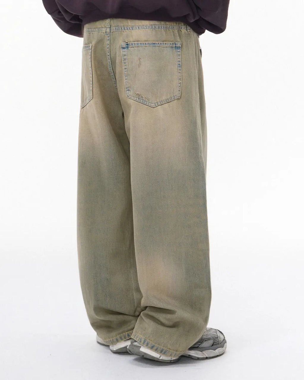 Beaded studded washed baggy jeans by Flation, featuring distressed denim, large pockets, and unique bead and stud embellishments.