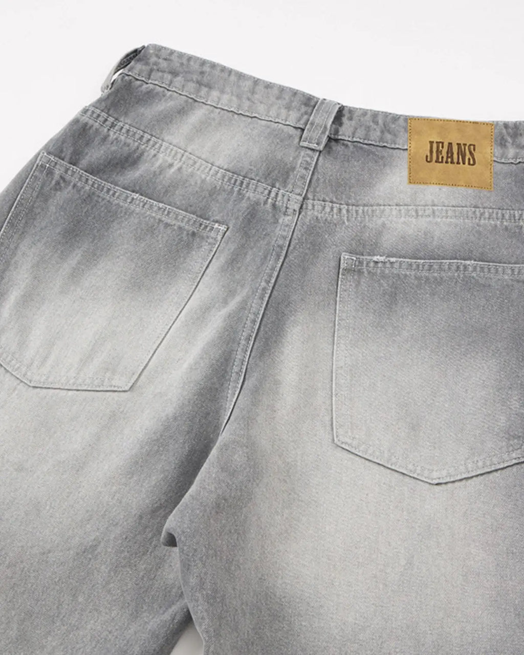 Blue acid wash barrel jeans from Flation Streetwear, showcasing relaxed fit and stylish distressed denim design.