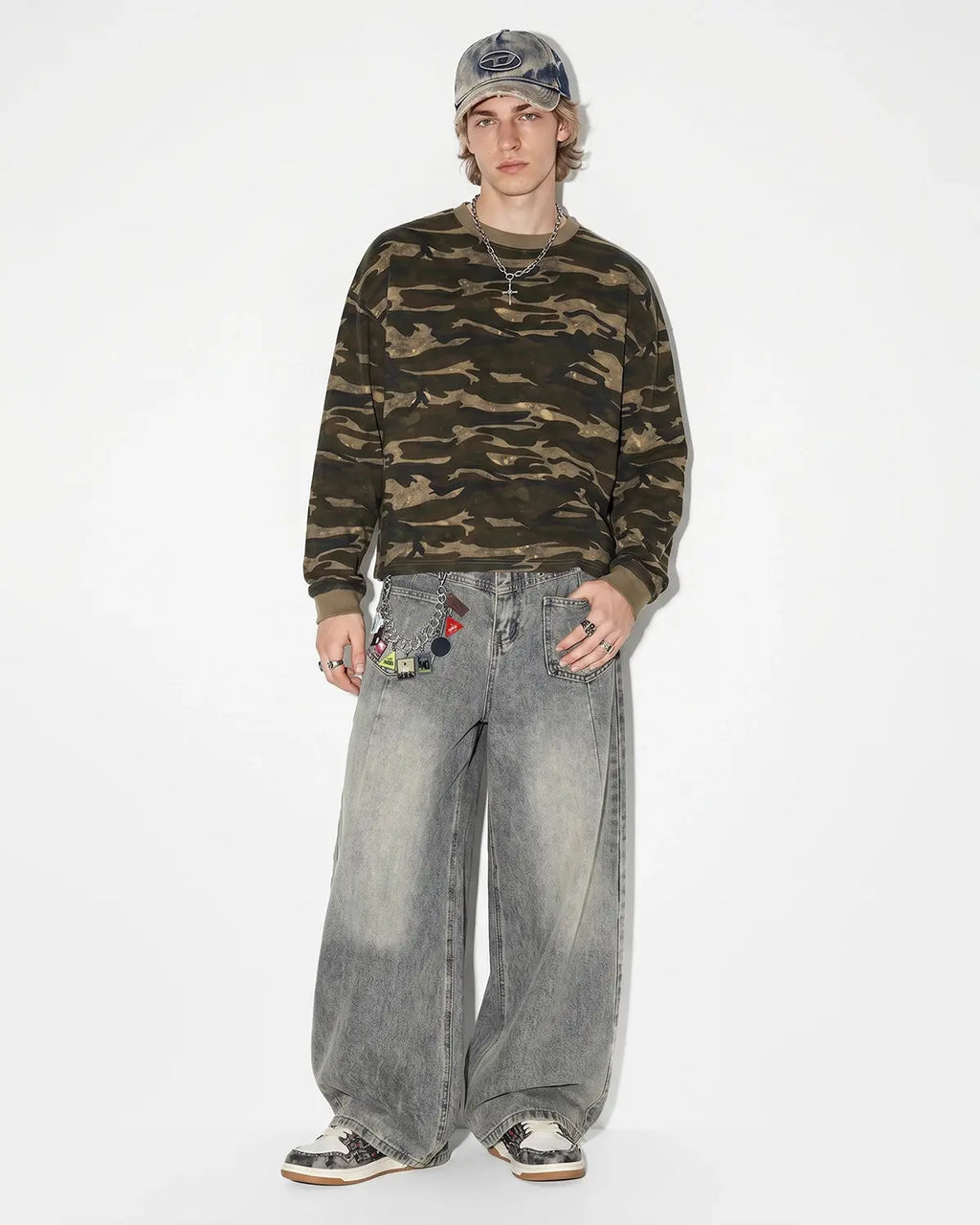 Distressed eyelet barrel jeans by Flation Streetwear featuring a relaxed fit, ripped details, and eyelet accents.