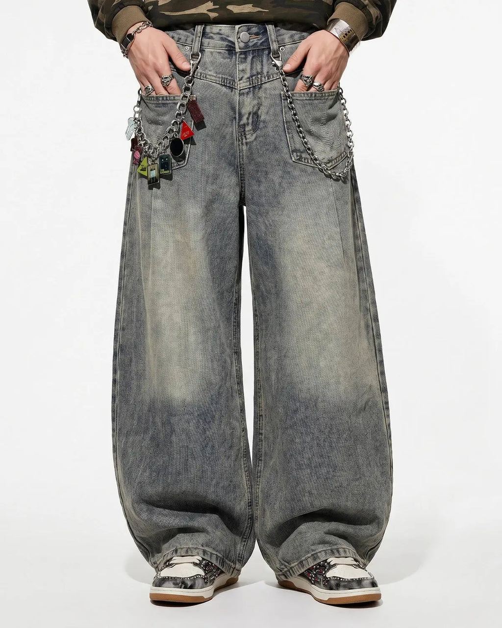Distressed eyelet barrel jeans by Flation Streetwear featuring a relaxed fit, worn details, and eyelet accents on denim.