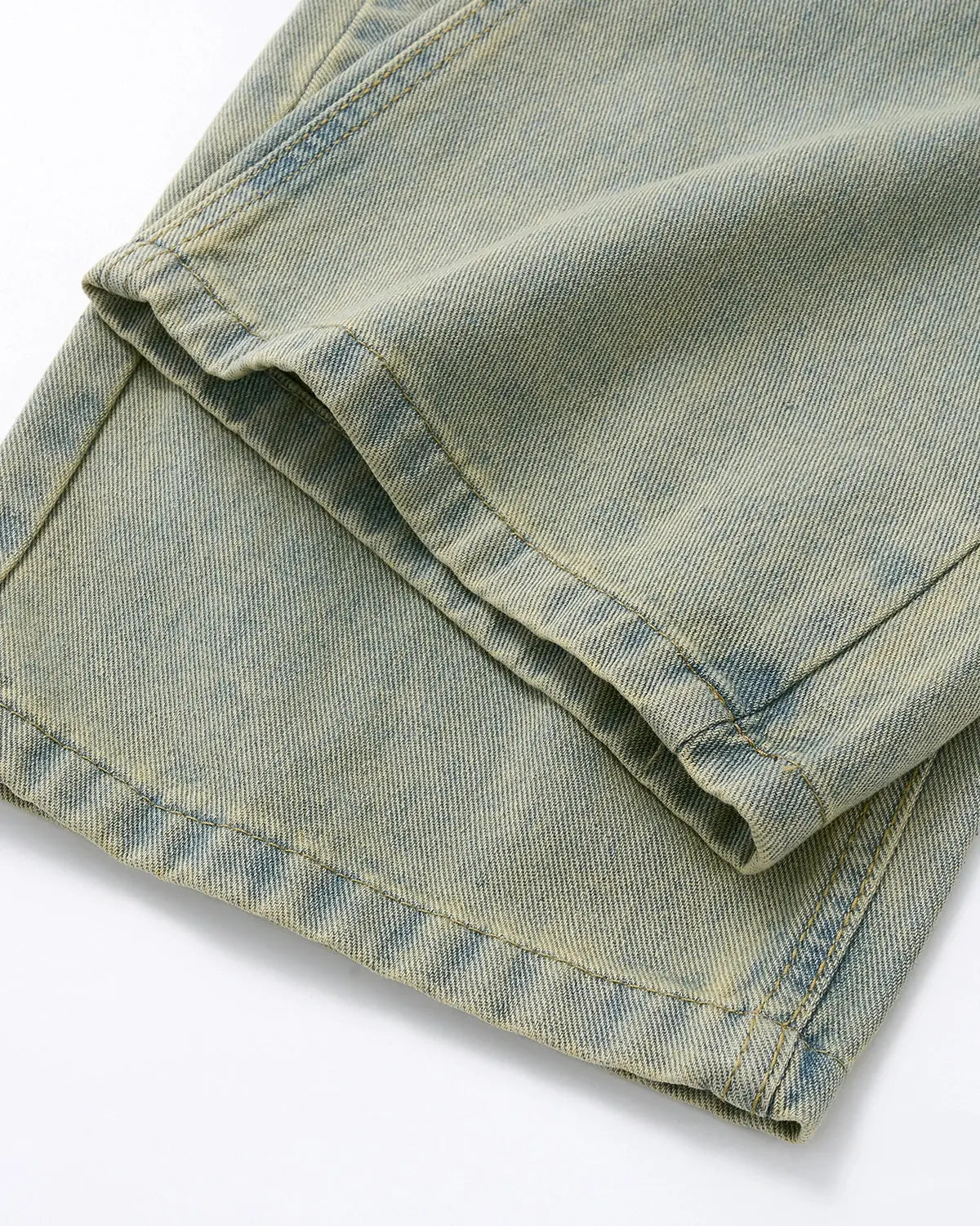 Vintage washed baggy jeans by Flation Streetwear with relaxed fit and faded denim, shown on a model.