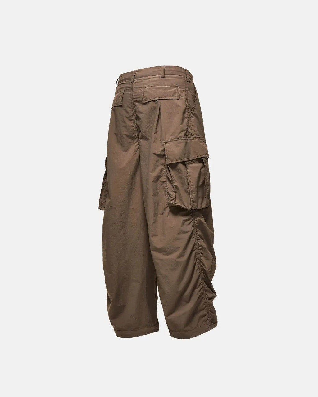 Black Flation parachute cargo pants with multiple pockets, streetwear style, made by Flation.