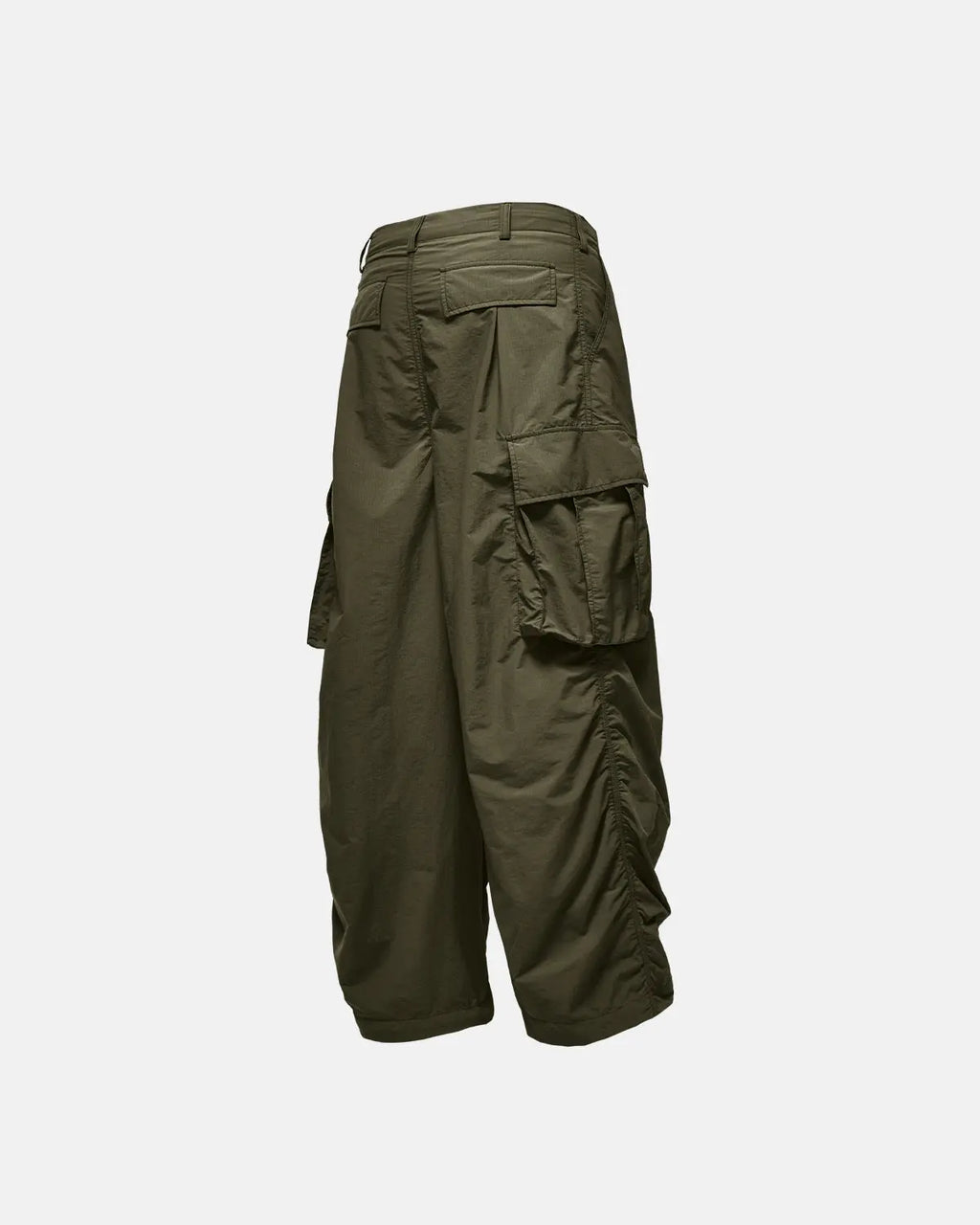 Black Flation Parachute Cargo Pants featuring multiple pockets and relaxed streetwear style, made by Flation.