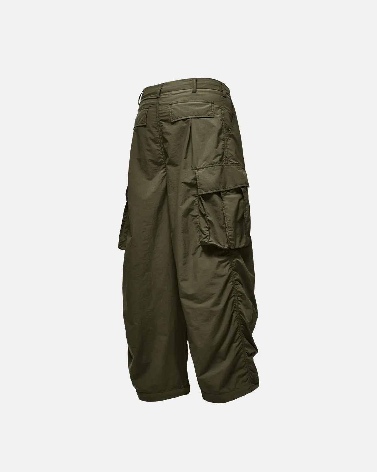 Black Flation Parachute Cargo Pants featuring multiple pockets and relaxed streetwear style, made by Flation.