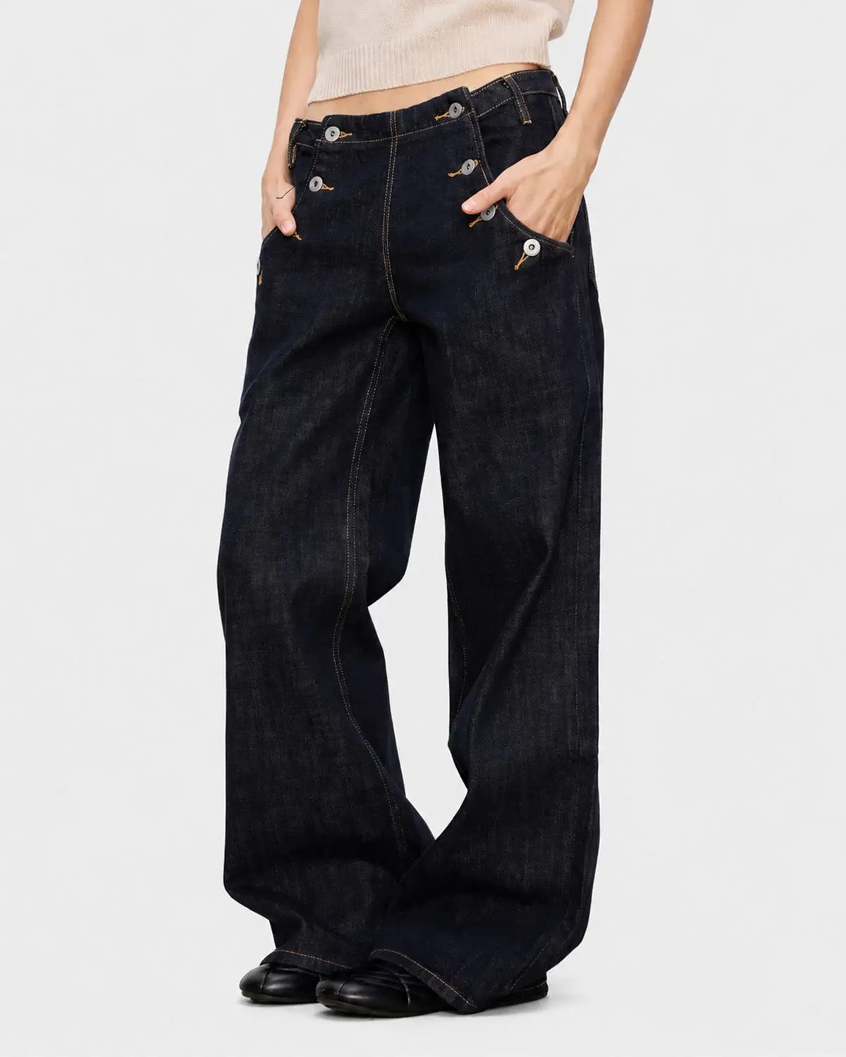 Black and blue button-detail raw wide-leg jeans by Flation Streetwear, featuring a relaxed fit and casual style.