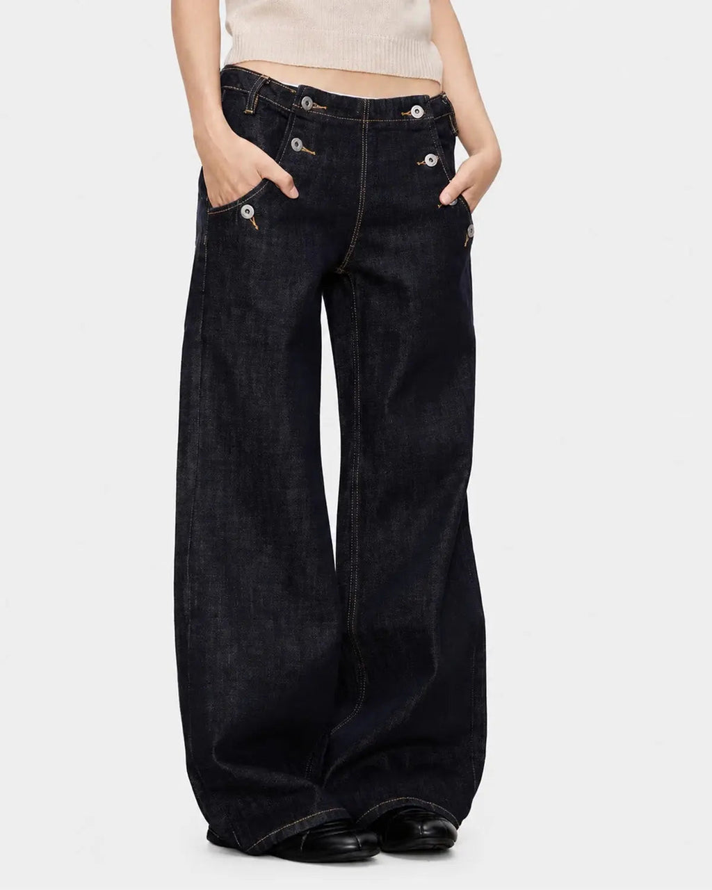 Black and blue wide-leg jeans with button details from Flation Streetwear, featuring raw hem and relaxed fit.